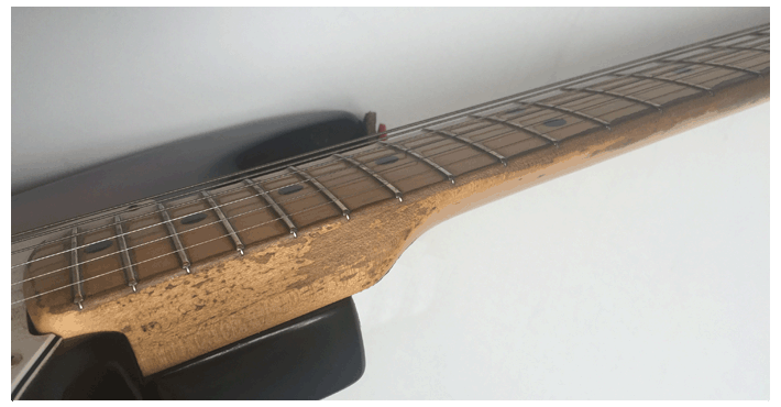 Worn neck guitar